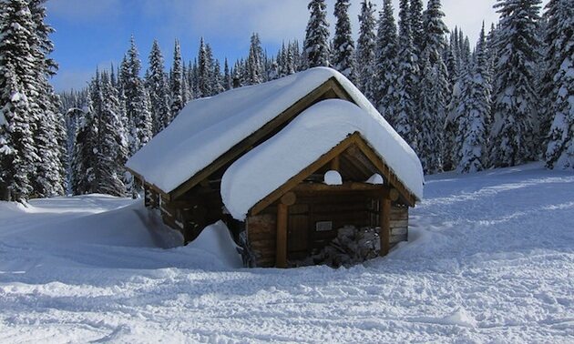 The snow-buried Owlhead warm-up cabin